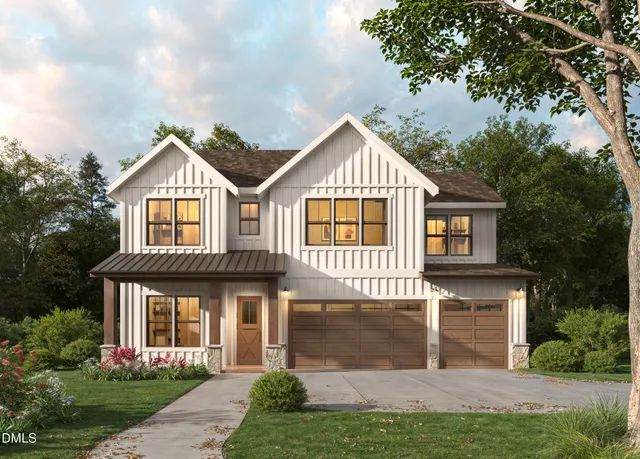 a front view of a house with a yard and trees
