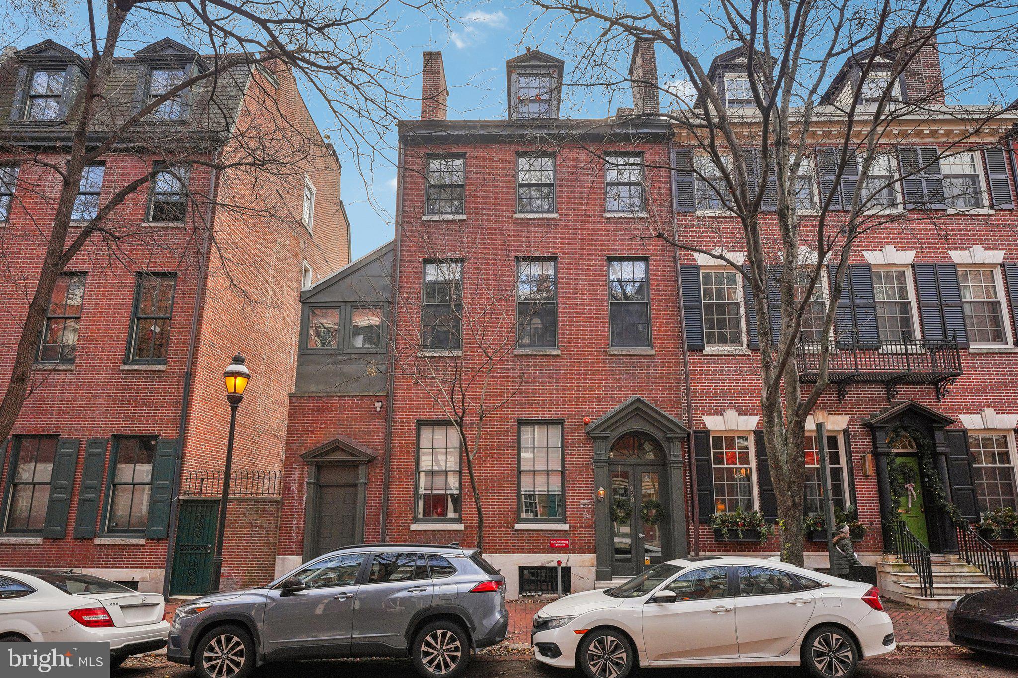 920 Clinton Street, Unit 3R Philadelphia, PA 19107 - Photo 1 of 24 a view of cars parked in front of a building