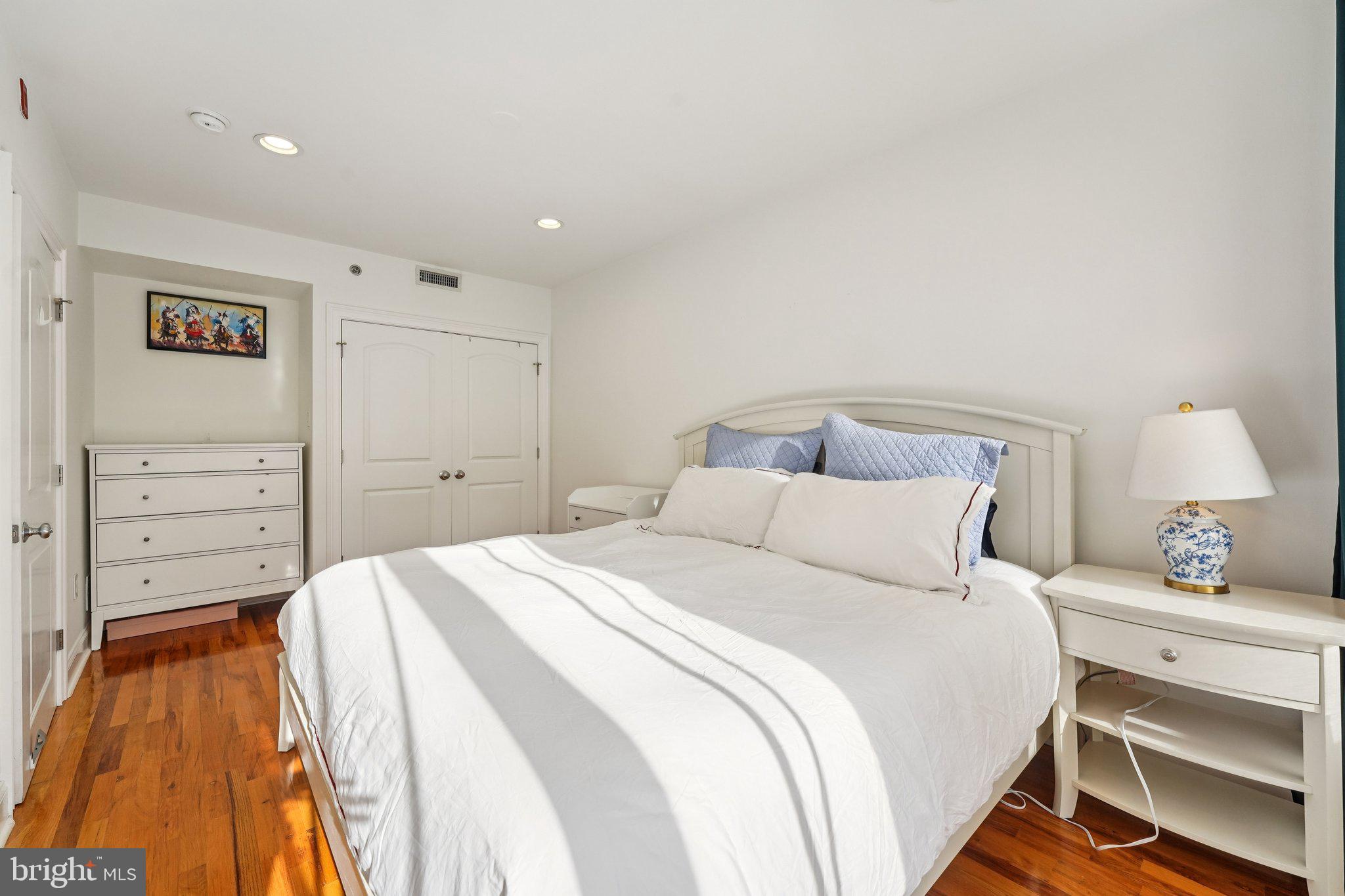 920 Clinton Street, Unit 3R Philadelphia, PA 19107 - Photo 17 of 24 a bedroom with a bed and a dresser