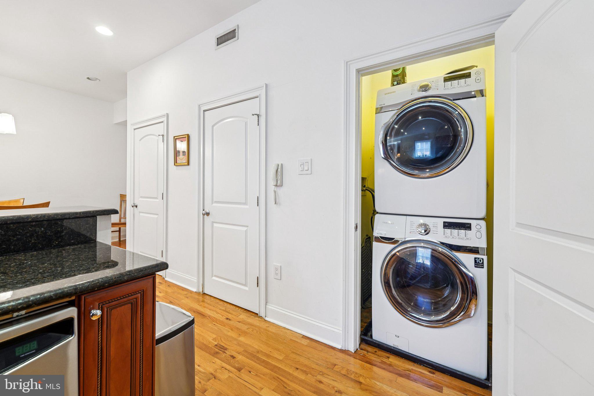 920 Clinton Street, Unit 3R Philadelphia, PA 19107 - Photo 20 of 24 a view of a hallway with washer and dryer