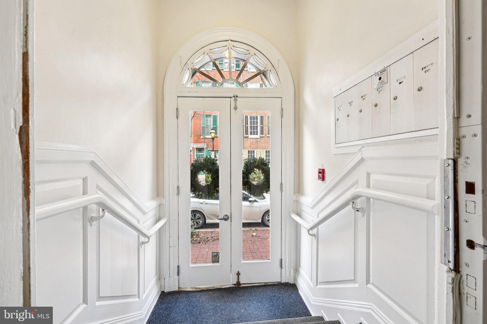 920 Clinton Street, Unit 3R Philadelphia, PA 19107 - Photo 23 of 24 a view of a hallway with entryway a hall and front door