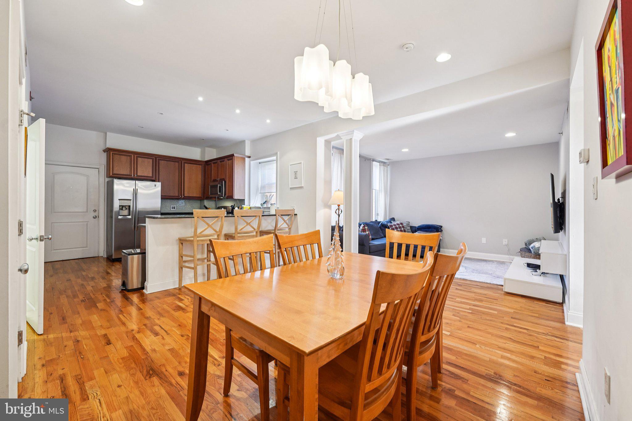 920 Clinton Street, Unit 3R Philadelphia, PA 19107 - Photo 9 of 24 a large kitchen with a table and chairs