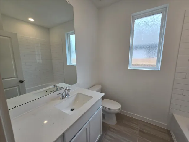 a view of a swimming pool with outdoor seating