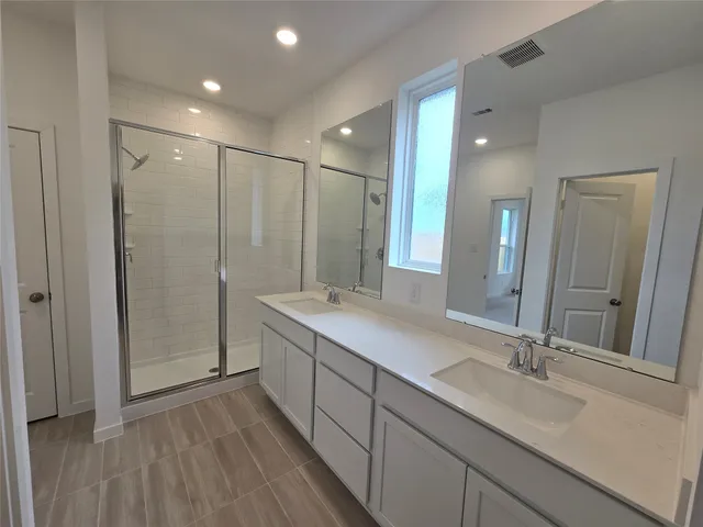 a view of a patio with table and chairs
