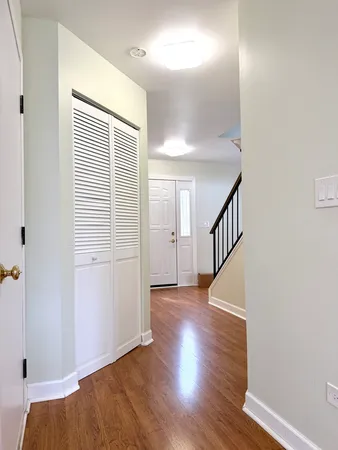 a view of hallway with wooden floor