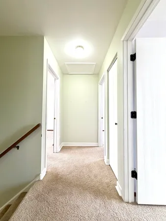 a view of a big room with closet and windows