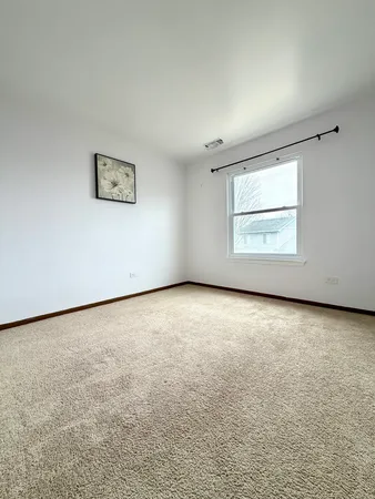 an empty room with a empty space and a window