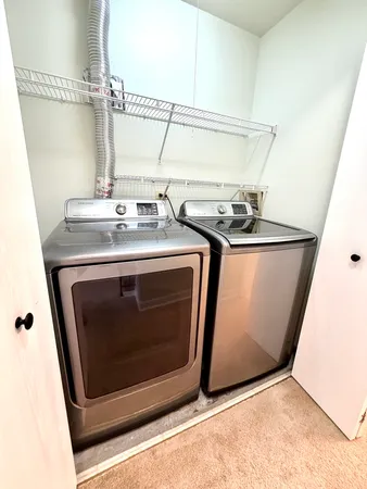 a view of a house with a yard and garage