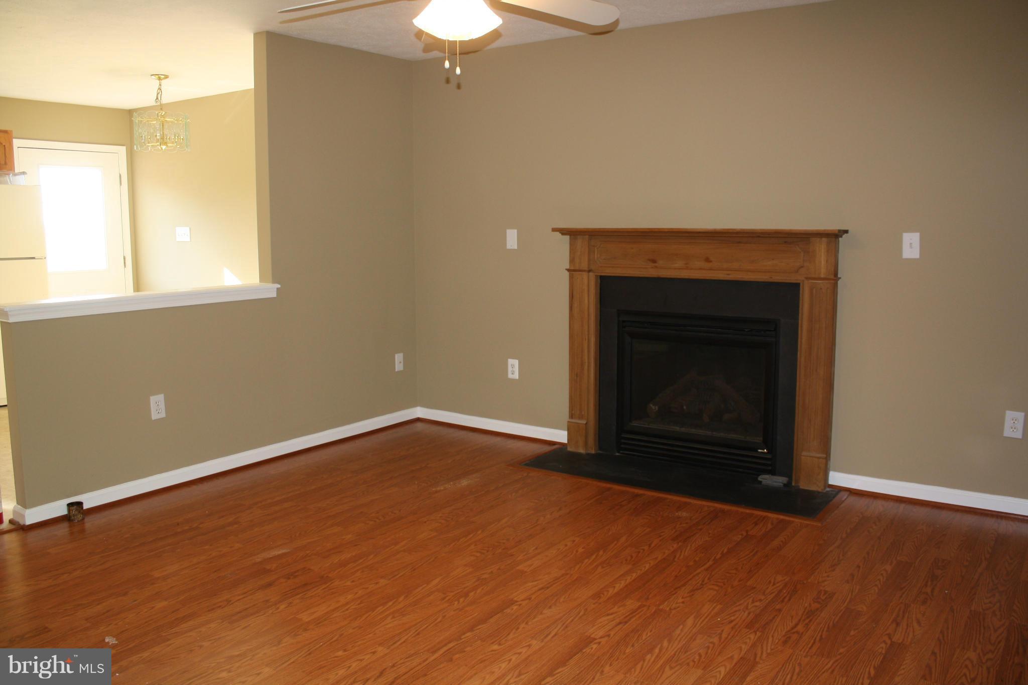 345 Mcdonalds Farm Road Linden, VA 22642 - Photo 13 of 29 an empty room with a fireplace and window