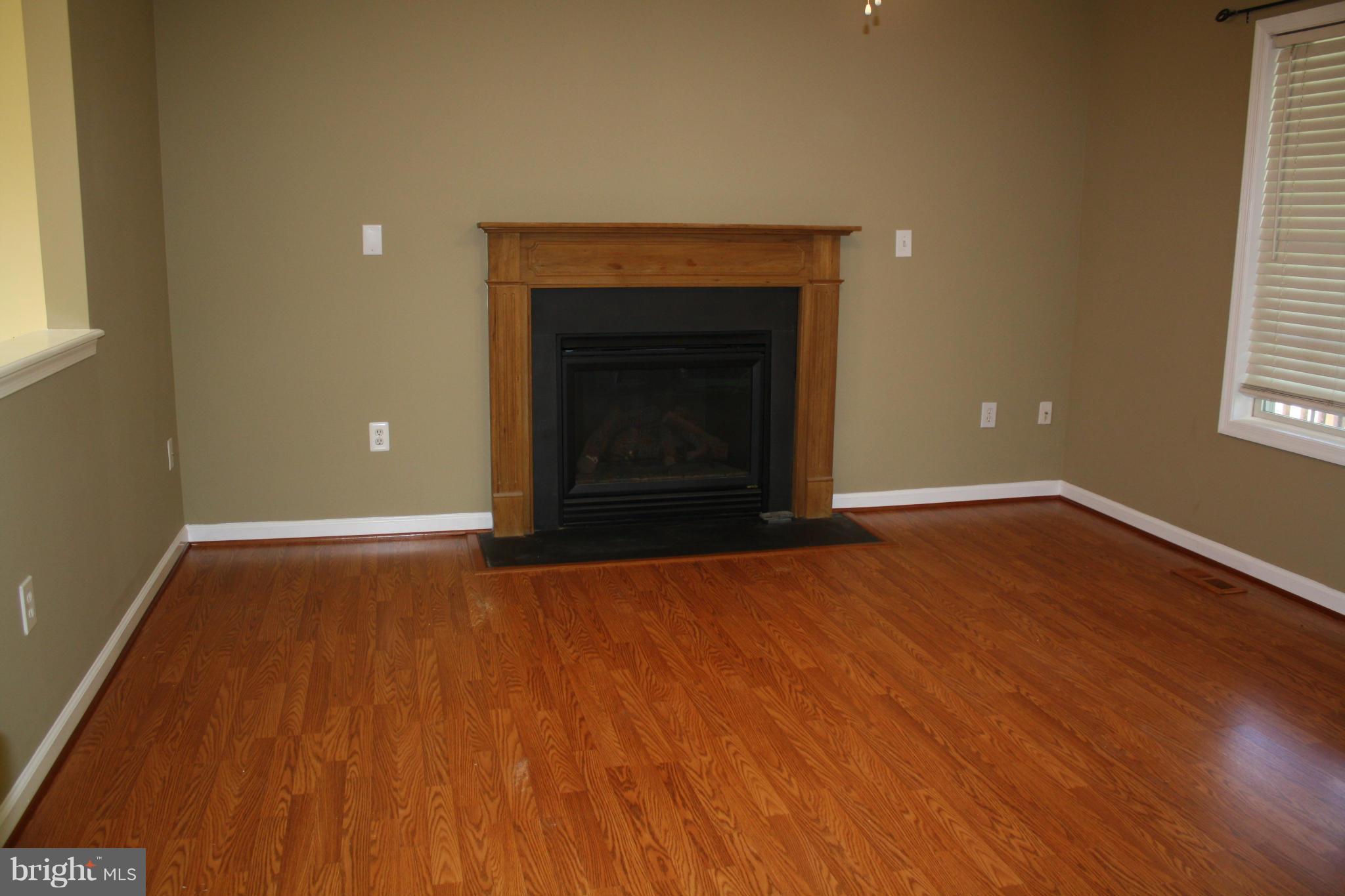 345 Mcdonalds Farm Road Linden, VA 22642 - Photo 14 of 29 a view of an empty room with wooden floor and a window