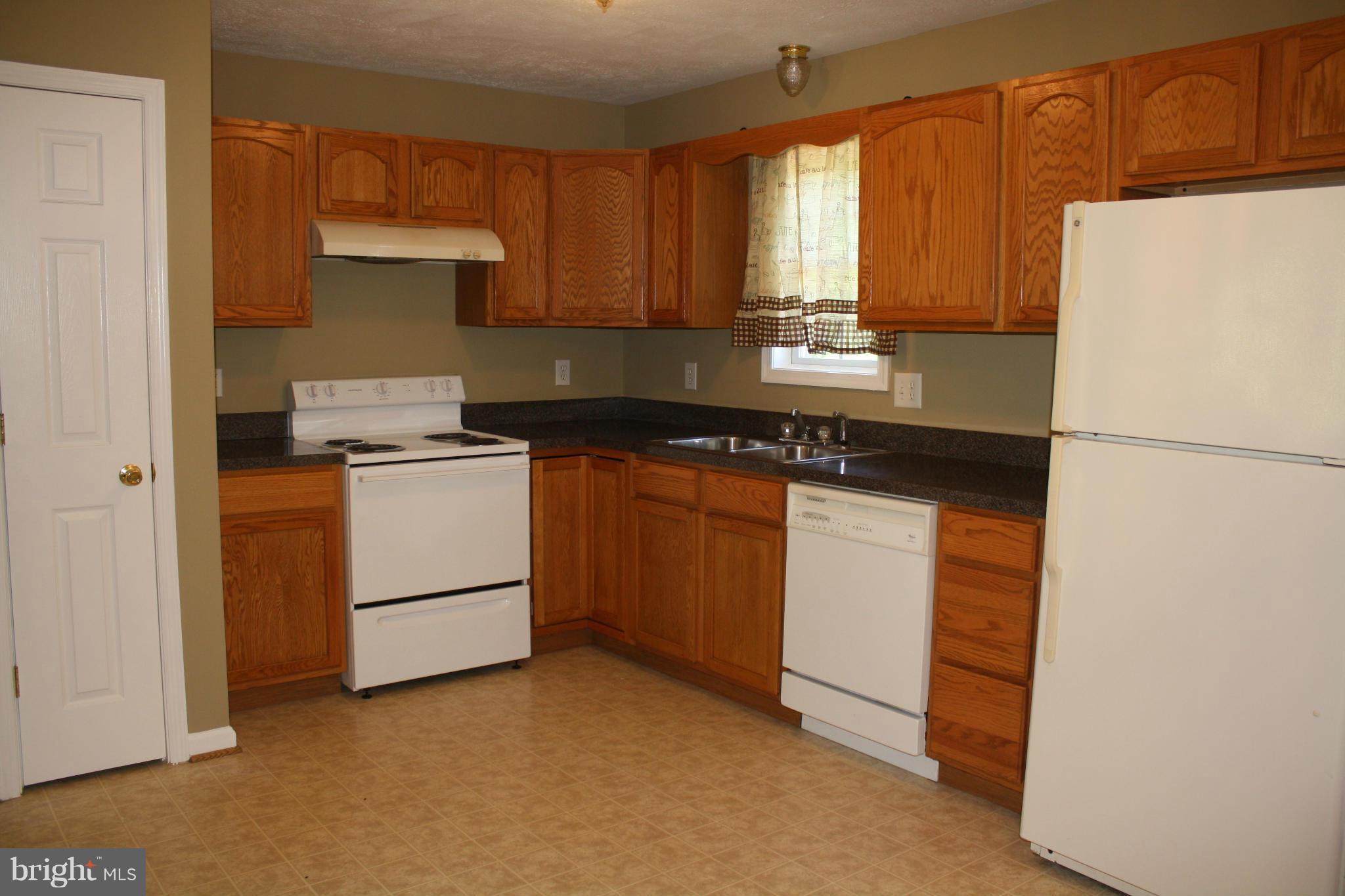 345 Mcdonalds Farm Road Linden, VA 22642 - Photo 18 of 29 a kitchen with cabinets appliances and a sink