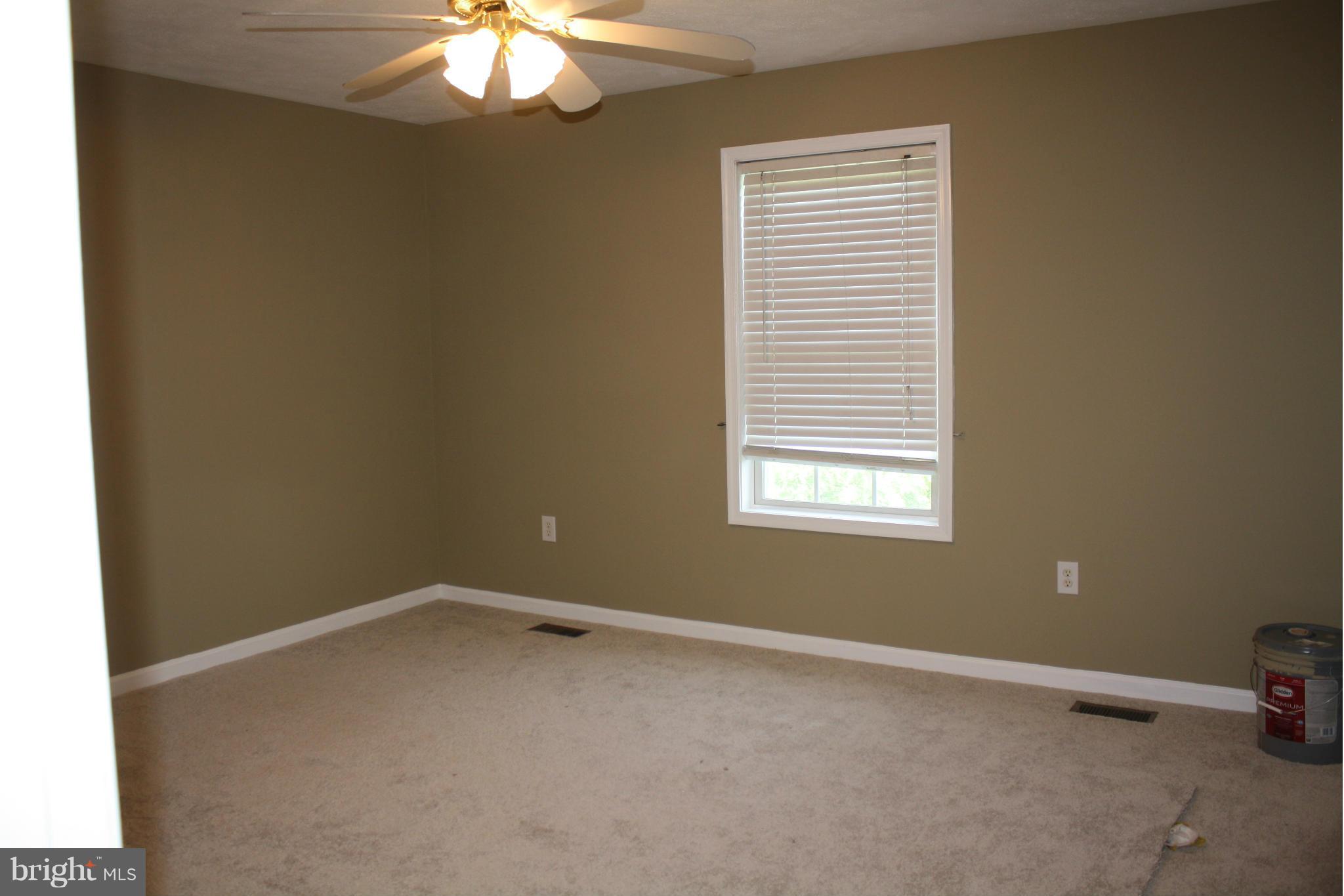 345 Mcdonalds Farm Road Linden, VA 22642 - Photo 20 of 29 an empty room with a window and a chandelier fan
