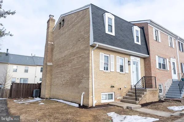 a front view of a house with stairs