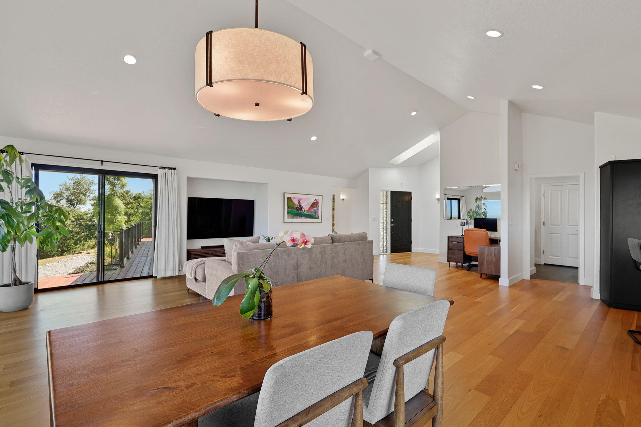 8454 Crown Way Redding, CA 96001 - Photo 12 of 44 a living room with furniture and a flat screen tv