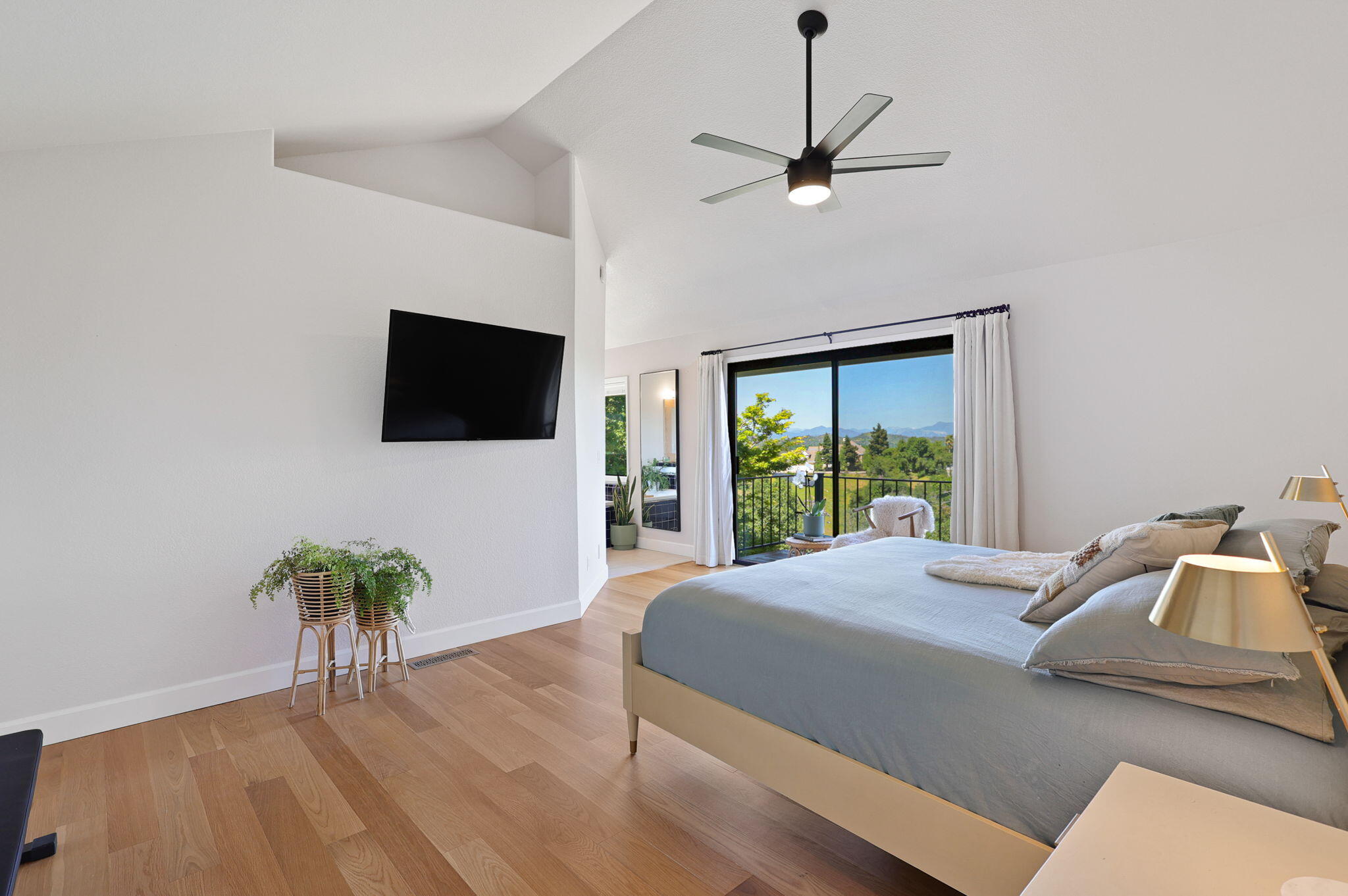 8454 Crown Way Redding, CA 96001 - Photo 14 of 44 a bedroom with a bed and a flat screen tv