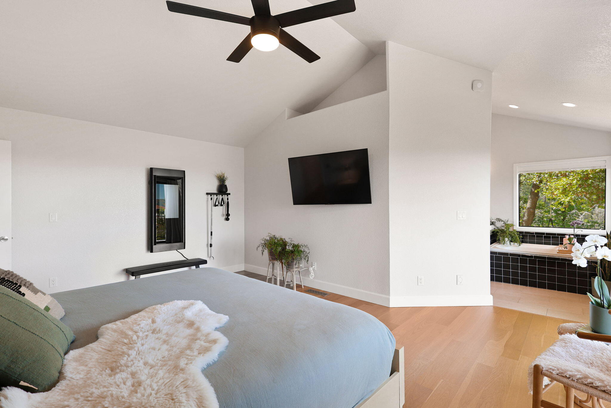 8454 Crown Way Redding, CA 96001 - Photo 15 of 44 a bedroom with a bed and a flat tv screen on dresser