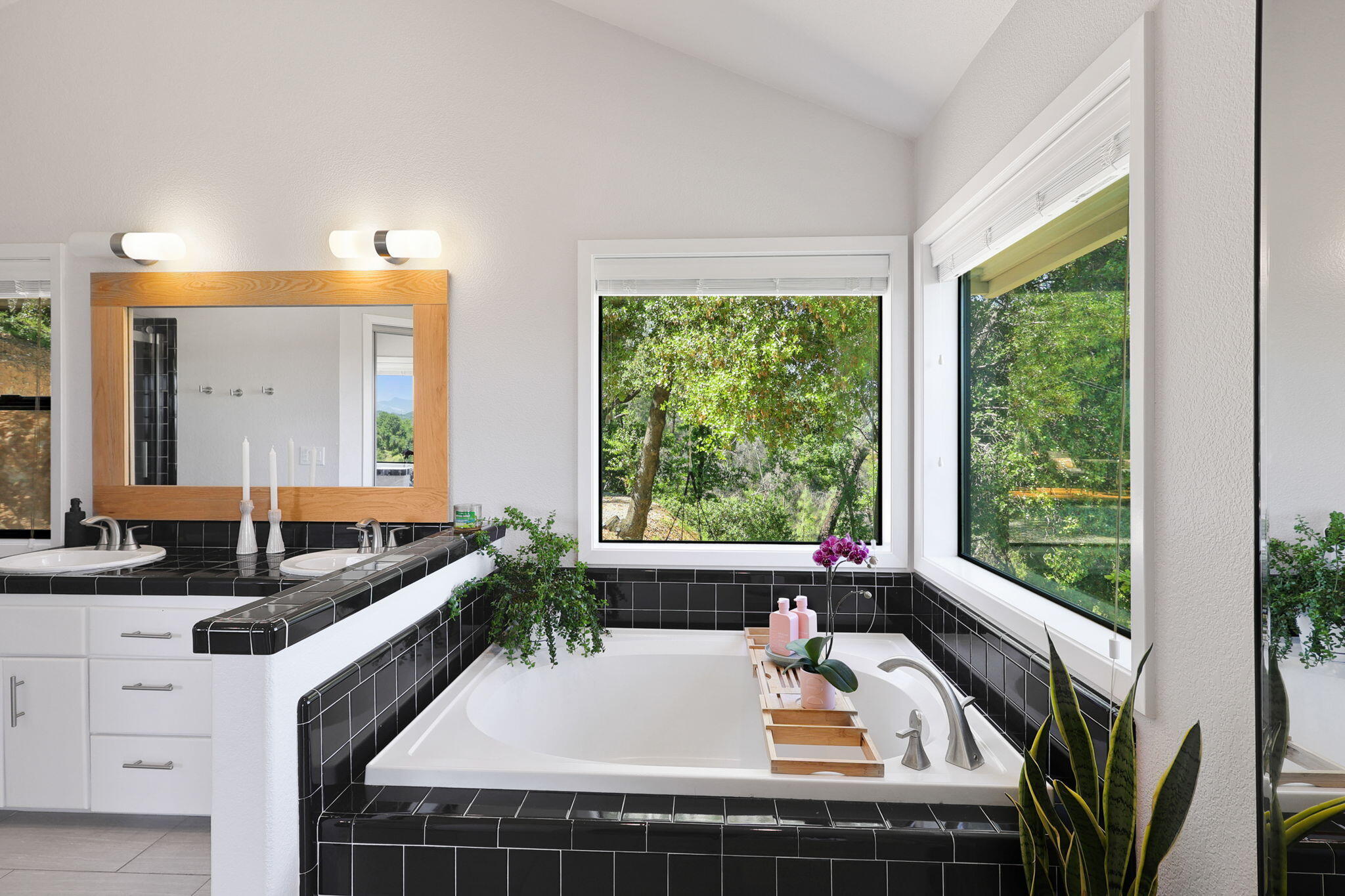 8454 Crown Way Redding, CA 96001 - Photo 16 of 44 a bathroom with a granite countertop tub and a sink