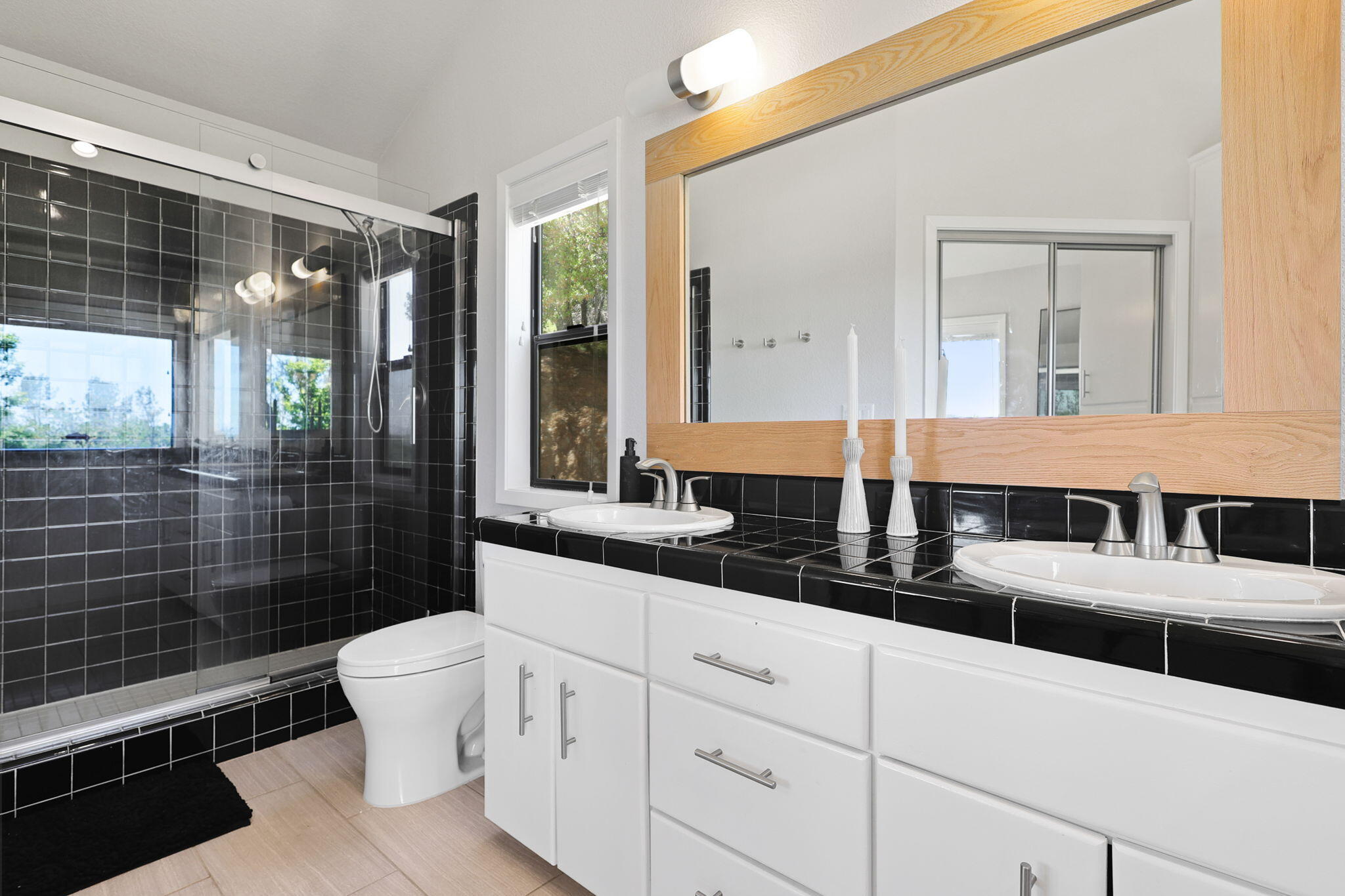 8454 Crown Way Redding, CA 96001 - Photo 17 of 44 a bathroom with a double vanity sink toilet and shower