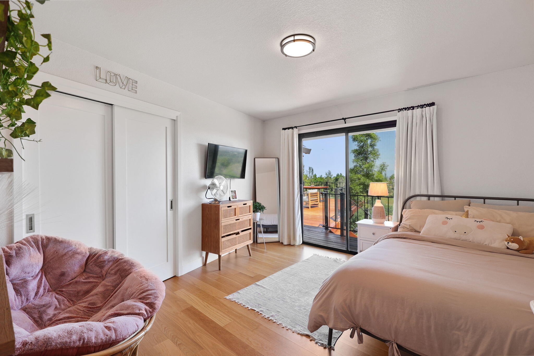 8454 Crown Way Redding, CA 96001 - Photo 18 of 44 a bedroom with a bed and wooden floor