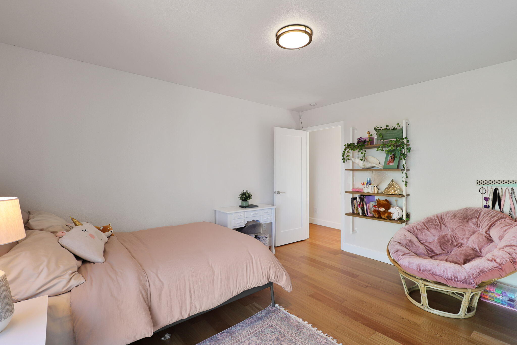 8454 Crown Way Redding, CA 96001 - Photo 19 of 44 a bedroom with a bed and wooden floor