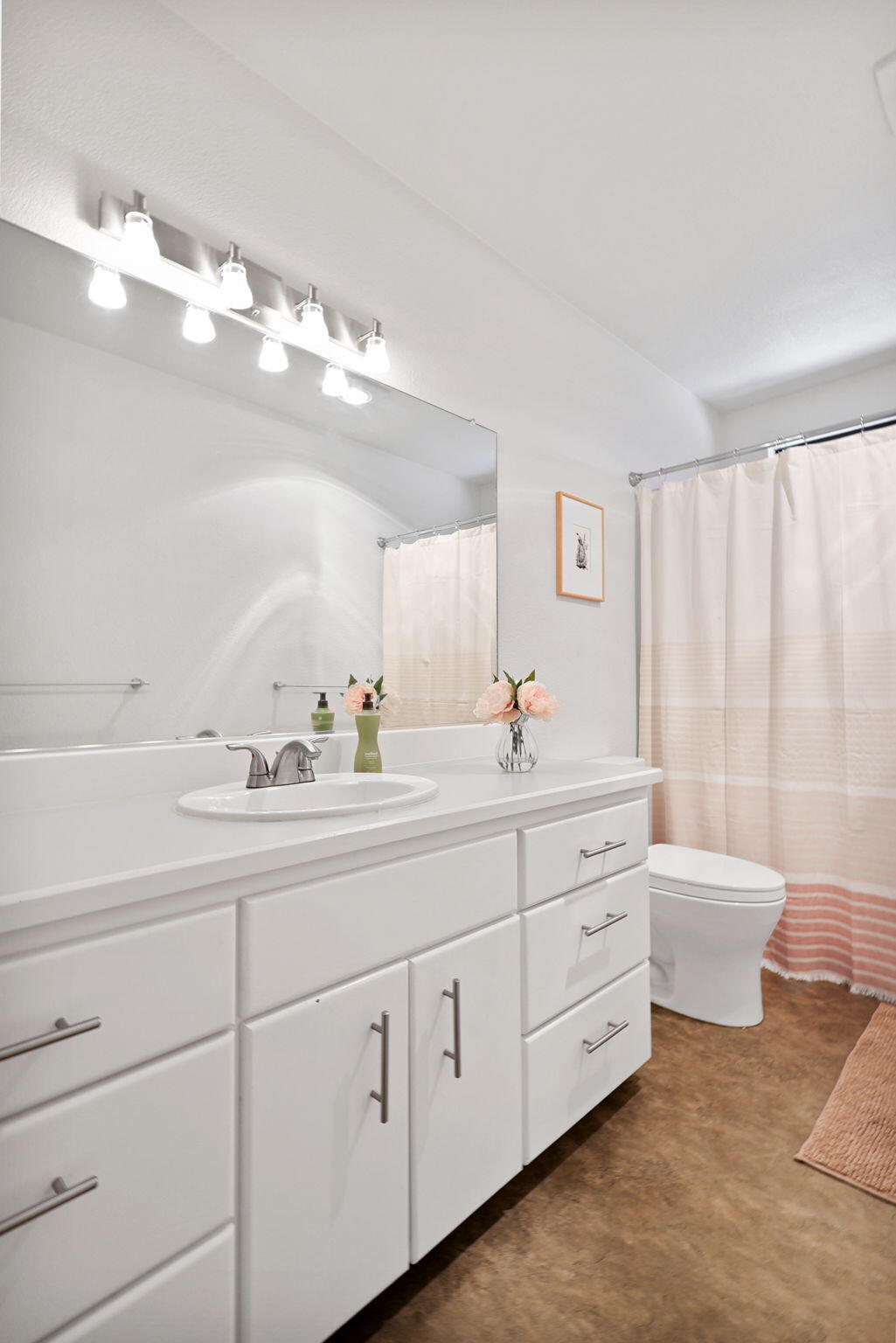 8454 Crown Way Redding, CA 96001 - Photo 20 of 44 a bathroom with a double vanity sink mirror bathtub and toilet