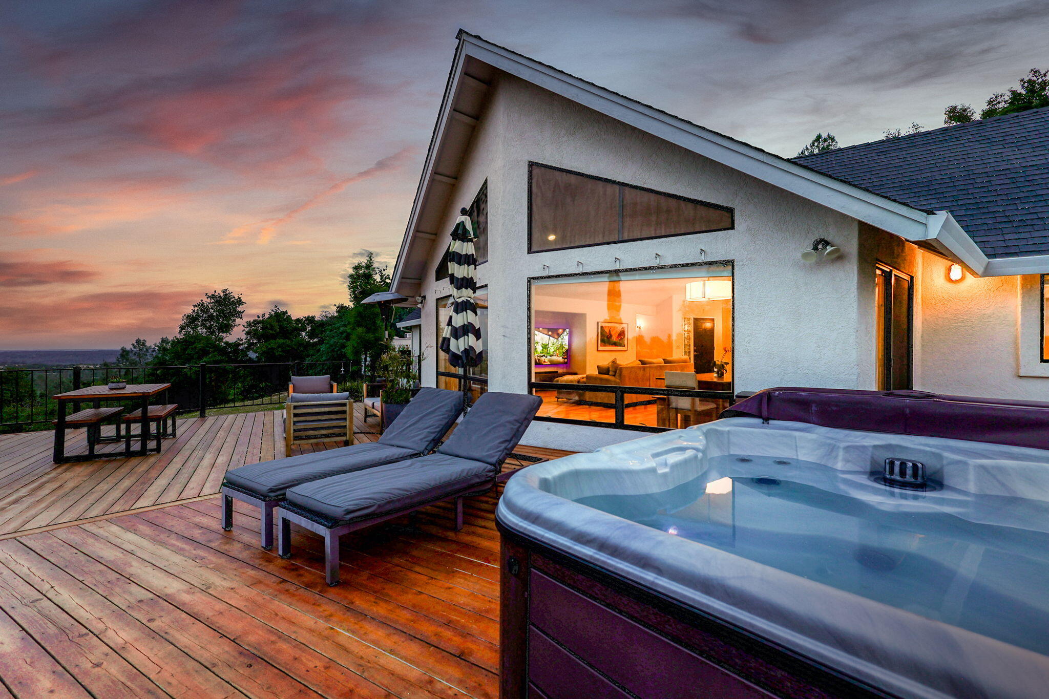 8454 Crown Way Redding, CA 96001 - Photo 31 of 44 a outdoor sitting area with furniture and wooden floor