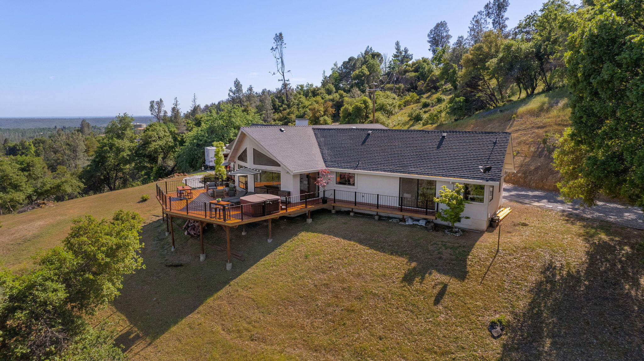 8454 Crown Way Redding, CA 96001 - Photo 38 of 44 an aerial view of a house with swimming pool garden and patio