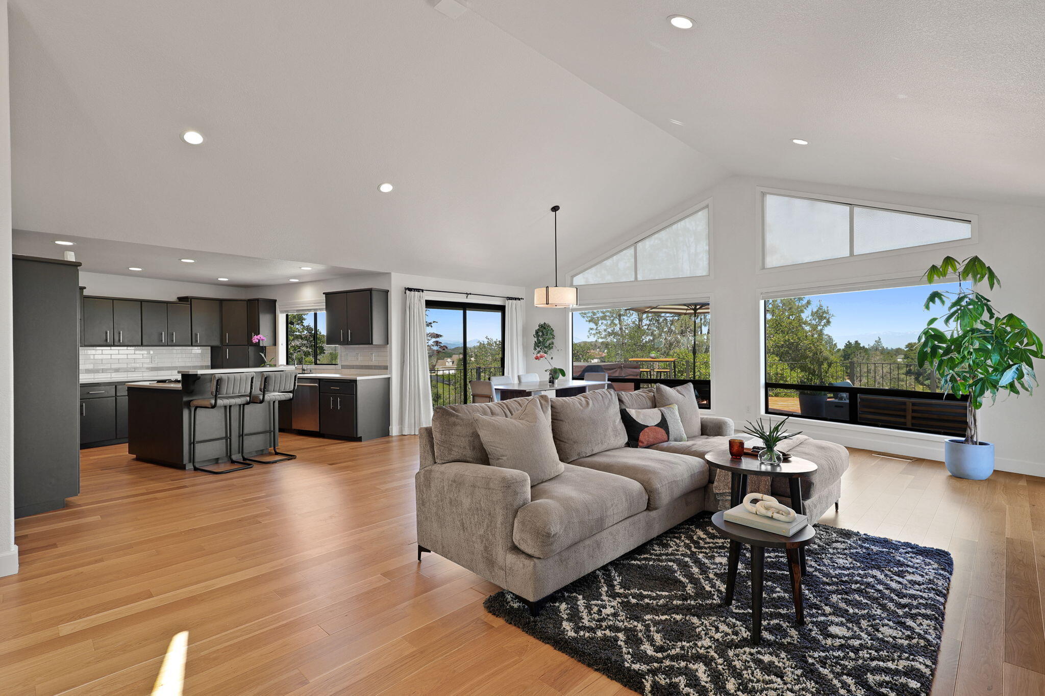 8454 Crown Way Redding, CA 96001 - Photo 4 of 44 a living room with furniture kitchen view and a large window