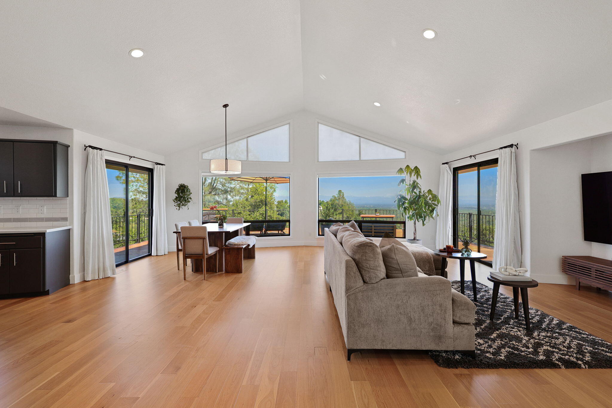 8454 Crown Way Redding, CA 96001 - Photo 6 of 44 a living room with fireplace furniture and a wooden floor