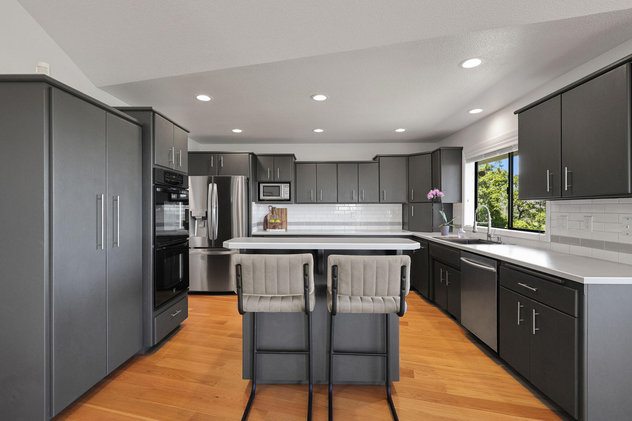 8454 Crown Way Redding, CA 96001 - Photo 7 of 44 a kitchen with stainless steel appliances granite countertop a refrigerator sink and cabinets