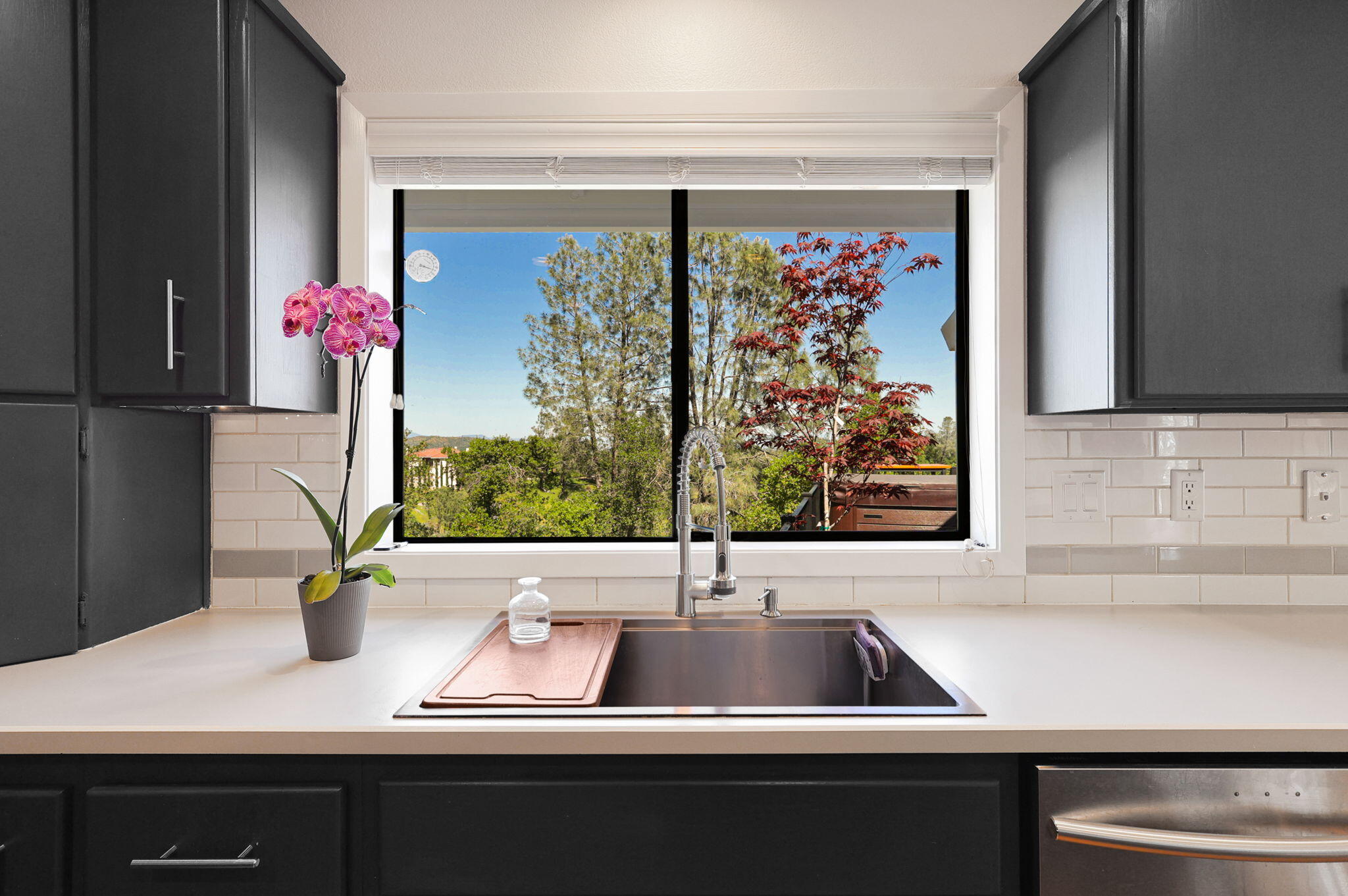 8454 Crown Way Redding, CA 96001 - Photo 10 of 44 a view of a sink with a dining table and chair