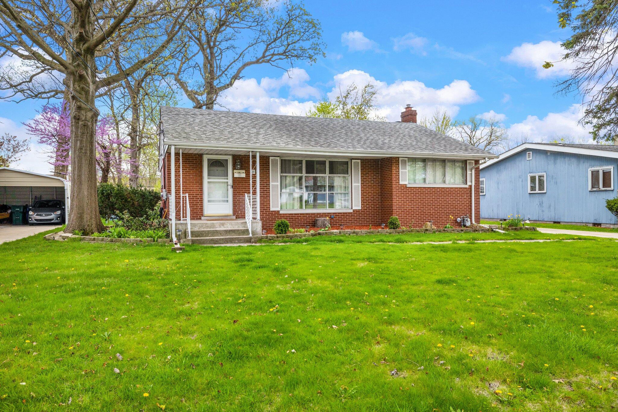 a view of a house with a garden