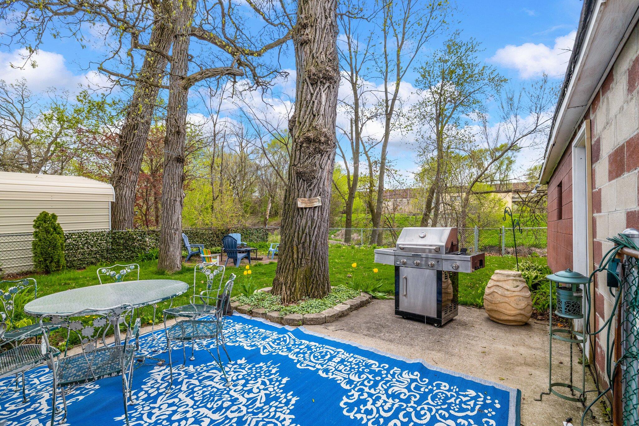 216 Southmoor Road Hammond, IN 46324 - Photo 16 of 19 a view of a chairs and table in backyard of the house