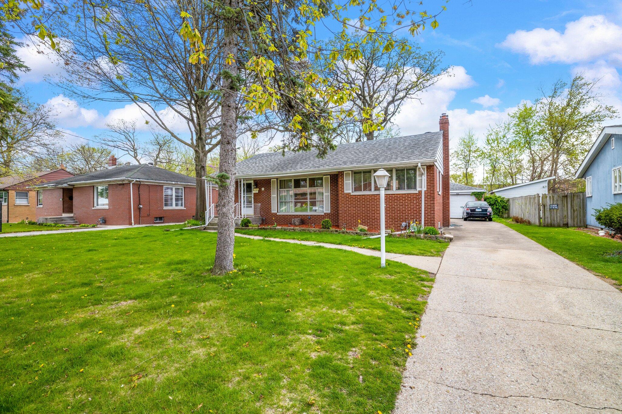 216 Southmoor Road Hammond, IN 46324 - Photo 19 of 19 a house that has a tree in front of a house