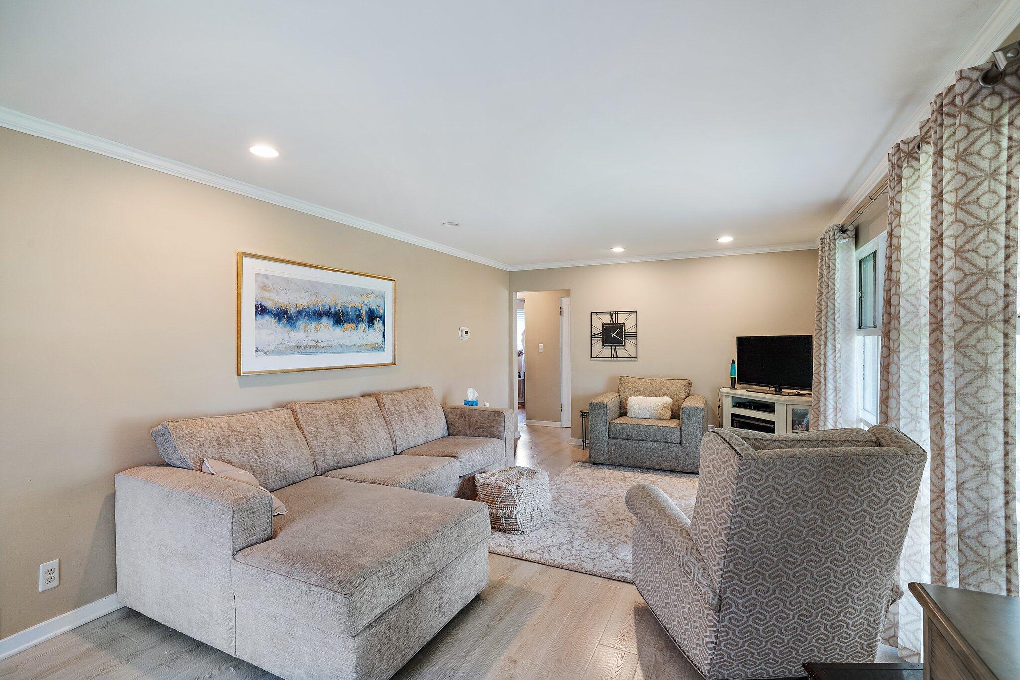 216 Southmoor Road Hammond, IN 46324 - Photo 4 of 19 a living room with furniture and a flat screen tv