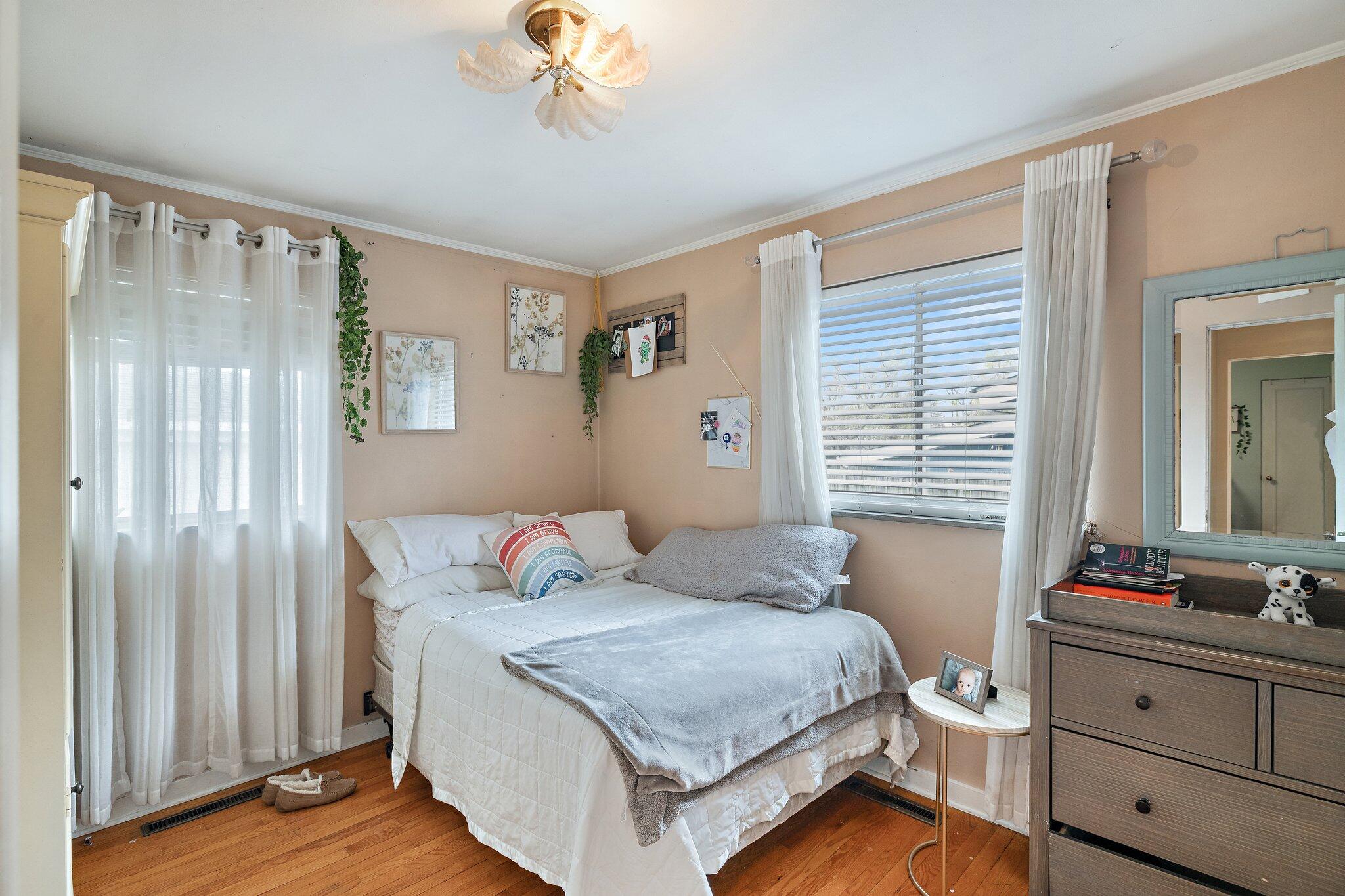 216 Southmoor Road Hammond, IN 46324 - Photo 8 of 19 a bedroom with a bed and a dresser