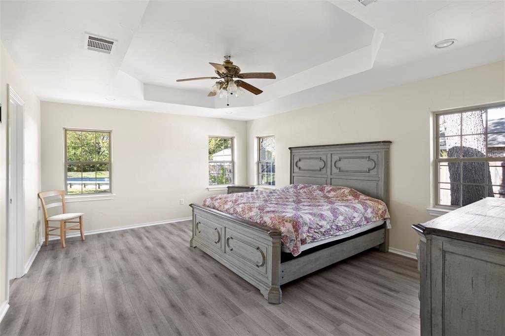 203 Main Street Red Oak, TX 75154 - Photo 20 of 32 a bedroom with a bed and window