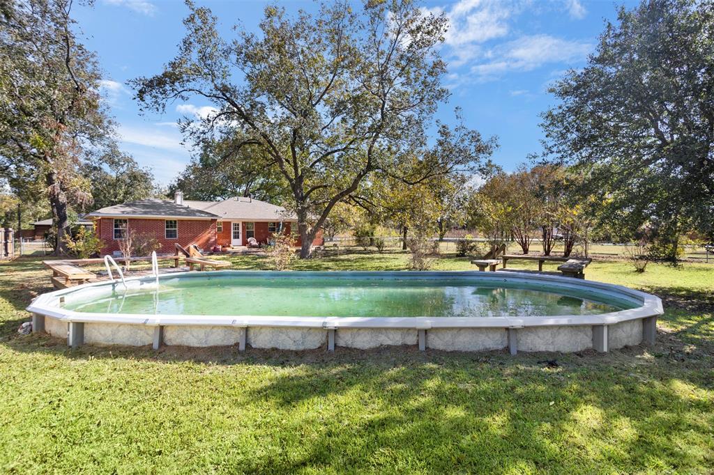 203 Main Street Red Oak, TX 75154 - Photo 28 of 32 a view of a house with a yard and sitting area