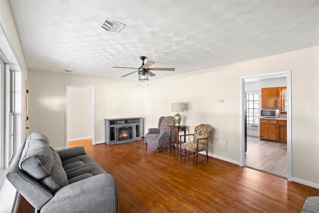 203 Main Street Red Oak, TX 75154 - Photo 9 of 32 a living room with furniture and a fireplace