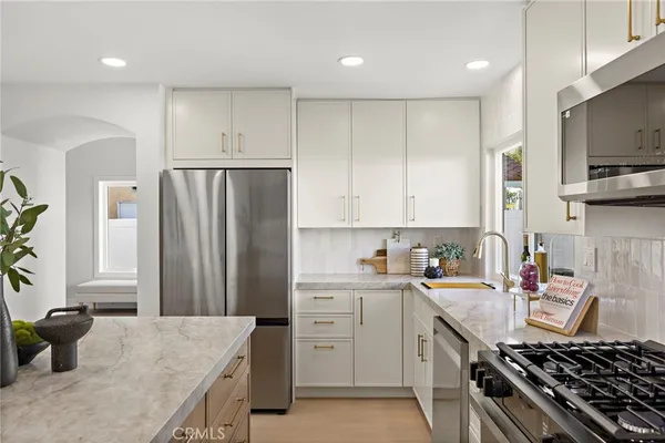 a kitchen with a sink a stove and refrigerator