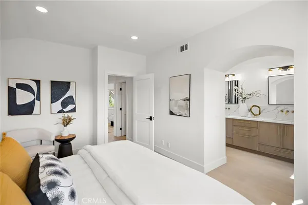 a bedroom with a bed and a couch