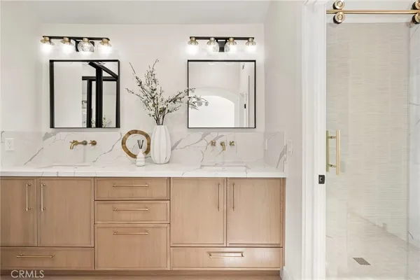 a bathroom with a sink vanity and a mirror