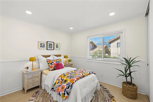 a bedroom with a bed and a window