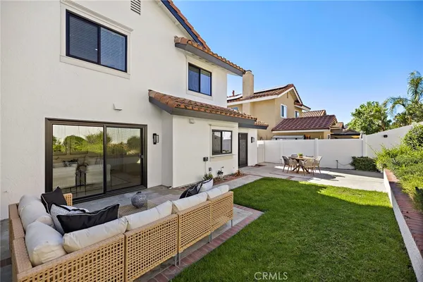 a front view of house with yard patio and green space
