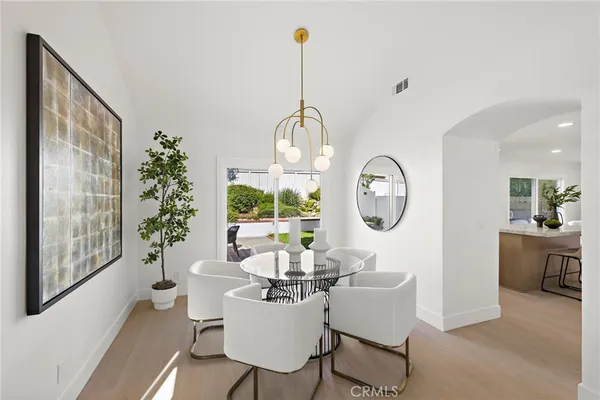 a living room with furniture a window and a chandelier