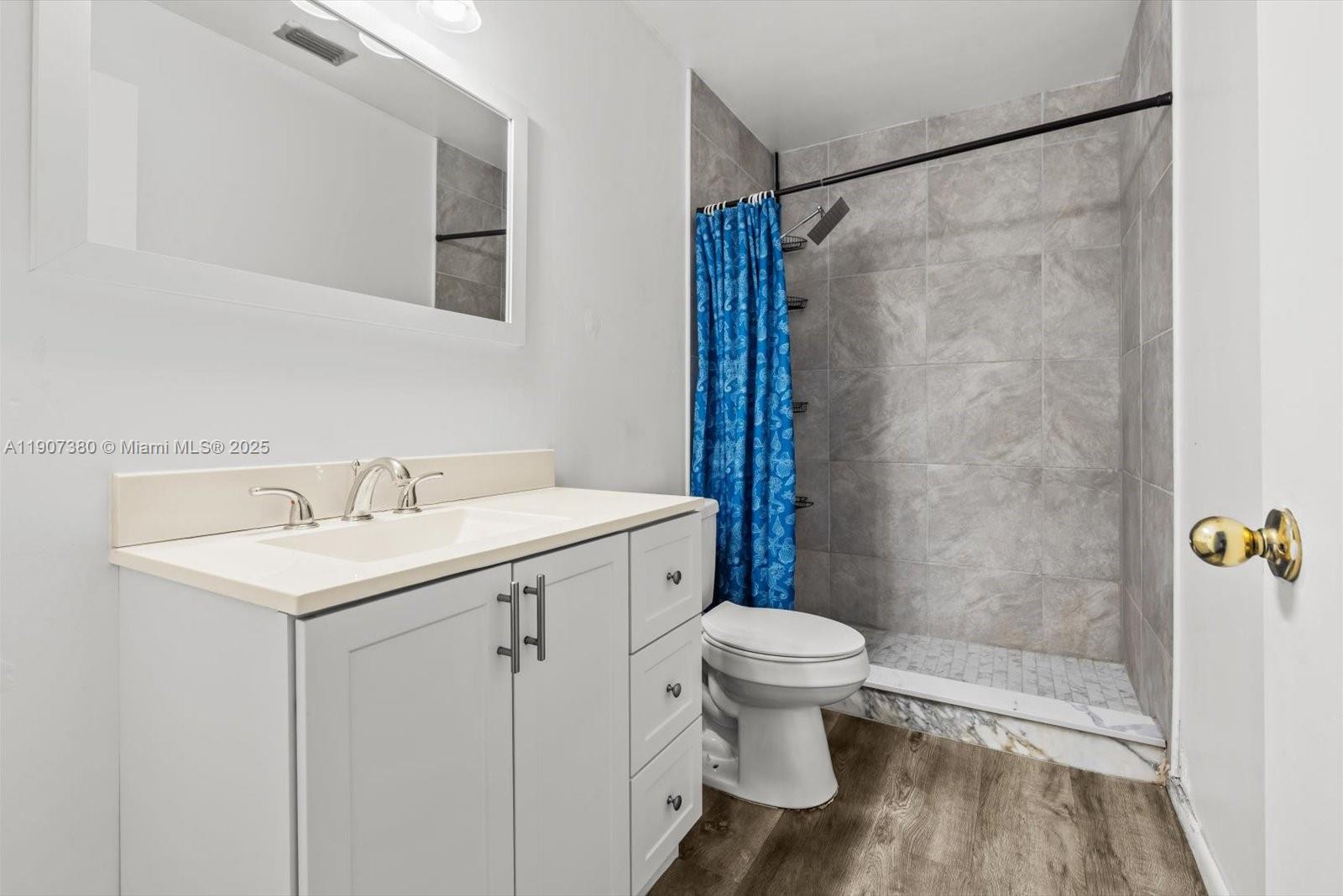 3502 Waterview Circle Palm Springs, FL 33461 - Photo 22 of 39 a bathroom with a sink toilet and shower