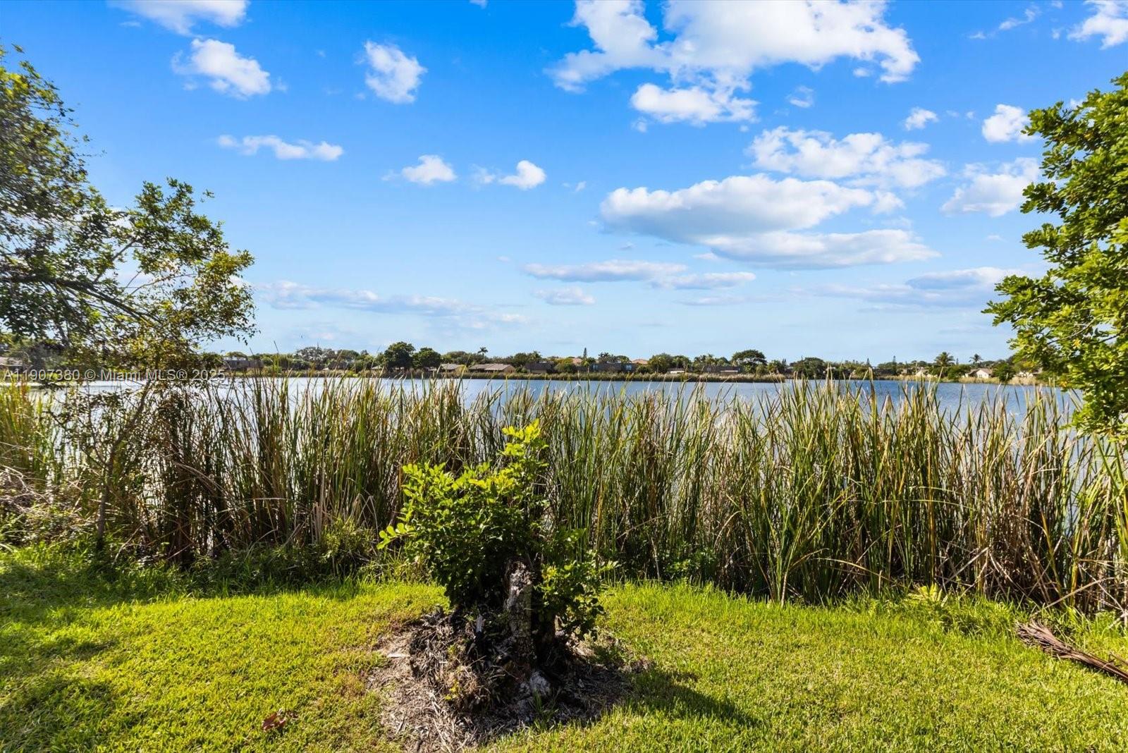 3502 Waterview Circle Palm Springs, FL 33461 - Photo 28 of 39 a view of lake with a yard