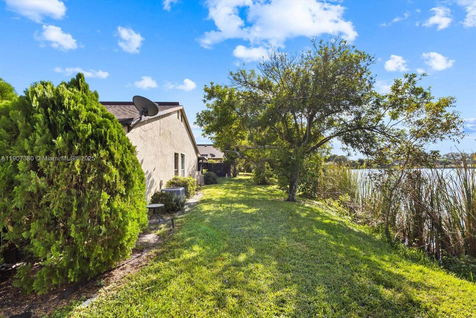 3502 Waterview Circle Palm Springs, FL 33461 - Photo 30 of 39 a view of a house with a backyard