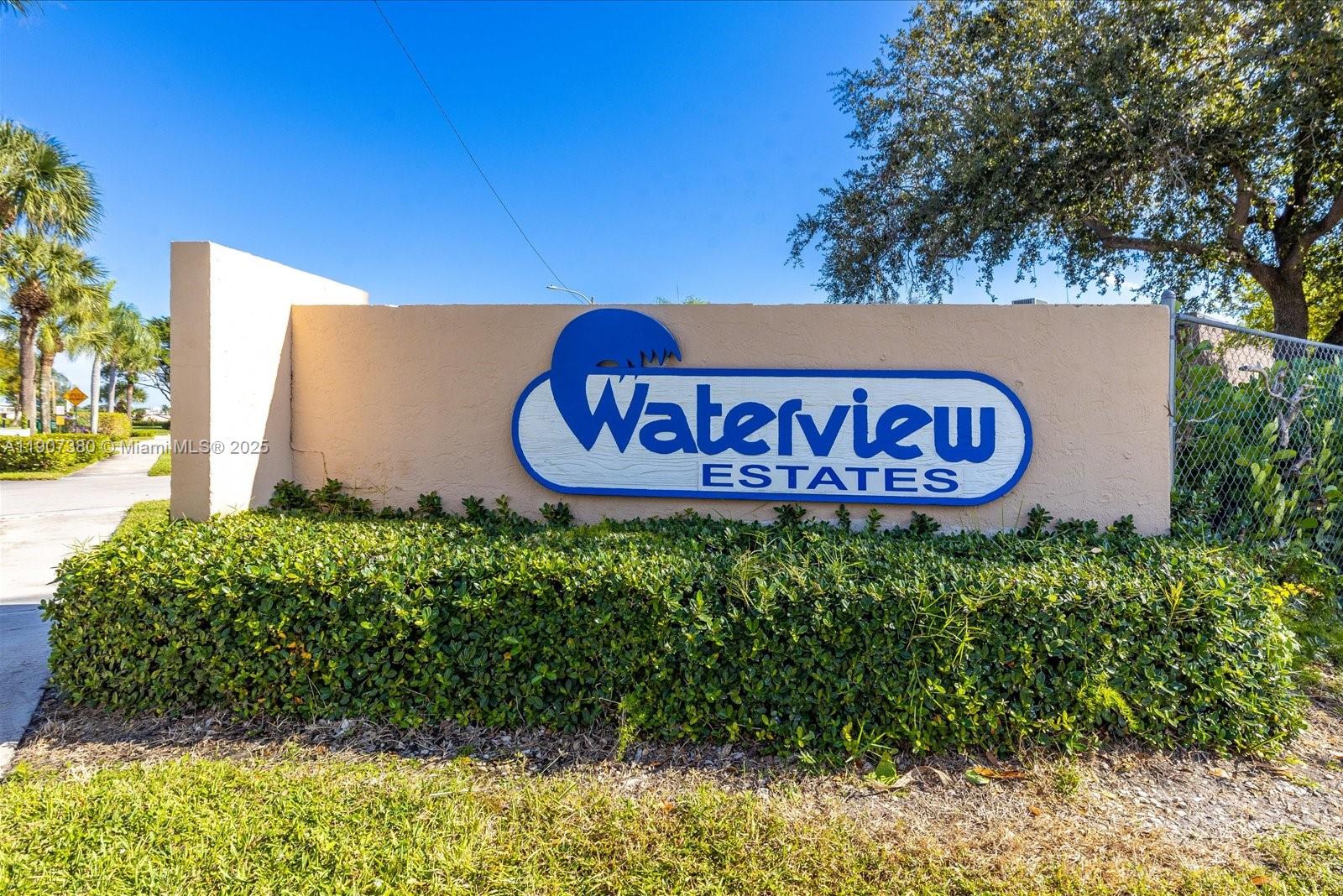 3502 Waterview Circle Palm Springs, FL 33461 - Photo 32 of 39 a sign that is on a brick wall