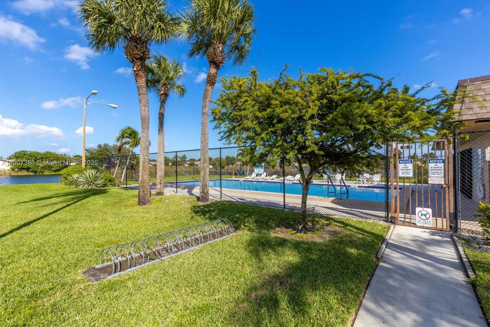 3502 Waterview Circle Palm Springs, FL 33461 - Photo 33 of 39 a house view with a garden space